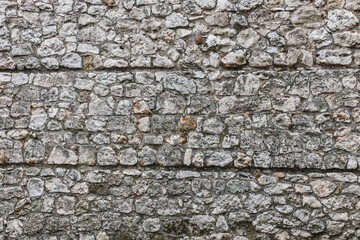 ściana z kamienia w średniowiecznym klimacie  o bezowej kolorystyce.