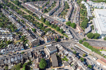 Aerial view of the area of Highams Park including the railway line and level crossing