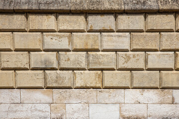 ściana z kamienia w średniowiecznym klimacie  o bezowej kolorystyce.