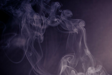 frankincense with white smoke on black background