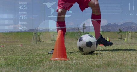 Animation of screen with biological data over biracial male soccer player during training - Powered by Adobe