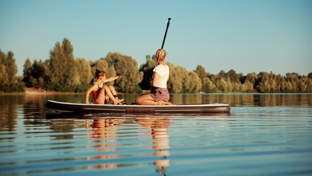 Travelling Water Tourism. Raft On SUP.Paddler Exploration Tranquil River.Sup Surfing Adventure. Stand up Paddling Surfboard Practice. Inflatable Board For Rowing. Surfer Balance Watersport Activities.