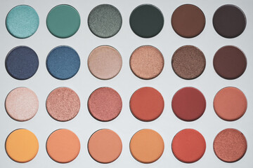 Fototapeta premium Selective focus of eyeshadow palette with various colors in pearly and matte closeup