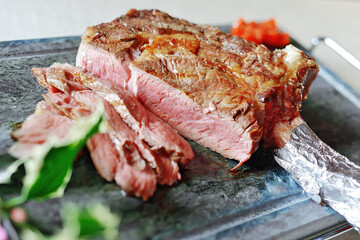 Fototapeta premium Ribeye steak on the bone sliced on stone