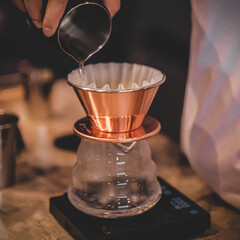 Coffee shop concept : Barista prepare coffee set drip and pour over water to cleaning paper drip