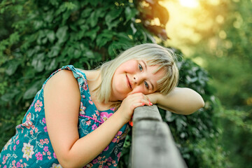 Trisomy 21 child having fun outside in summer season