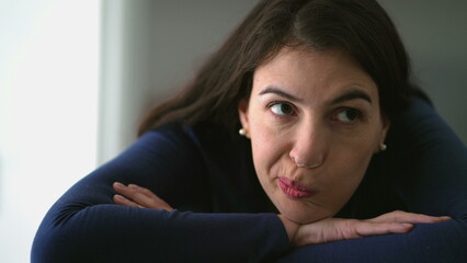 Obraz premium Thoughtful happy woman daydreaming. Pensive 30s person smiling leaning on table being positive about life