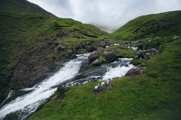 Fototapeta na wymiar Skarðsáfossur Waterfall on Vagar in Faroe Islands
