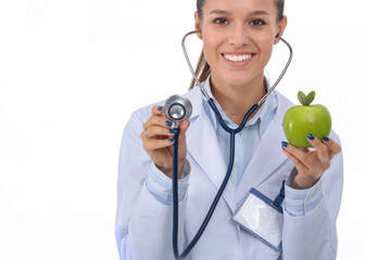 Medical doctor woman examining apple with stethoscope. Woman doctors