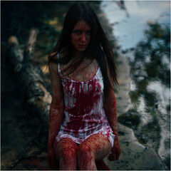 Girl in the blood. girl in a bloodstained white T-shirt. Zombie Girl. Girl in blood, looks like a...