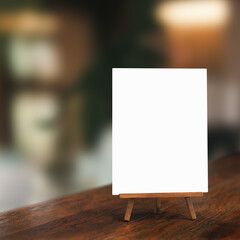 White paper counter menu on blurred restaurant background	
