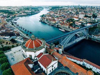 Obraz premium Porto Portugal Aerial View. Dom Luis Bridge at Sunrise. Porto, Portugal. Cityscape of Downtown Touristic Ribeira. Olt Town. Douro River.
