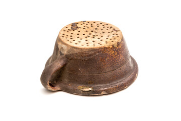 Old used pasta colander isolated on white background.