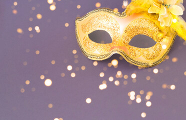 Carnival mask against a background in light lavender shades. Mardi Gras concept or New Years decoration. Trendy colors 2021. Creative copy space.