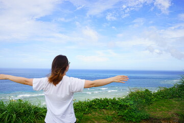 Outstretched Arms, Open Arms Woman standing at Kasarizaki in Amami Oshima, Kagoshima, Japan - 日本 鹿児島県 奄美大島 笠利崎 観光客 手を広げる 女性	