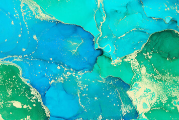 Abstract colorful background, wallpaper. Bright alcoholic ink, mixing of acrylic paints. Modern art, painting, a mixture of green and blue colors, glowing golden streaks