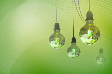 Light bulbs on a green background as a symbol of alternative green energy.