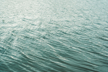 Waves on river water during sunset