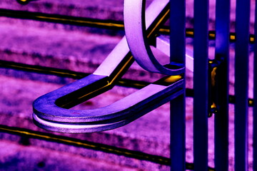 Metal railing on the stairs as a colorful background, changed color scheme.