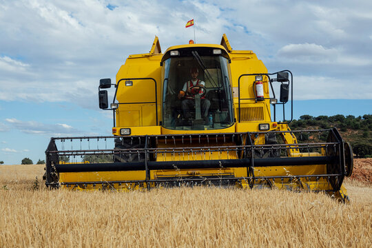 Combine harvester in agricultural field
