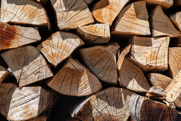 Stack of firewood background. Wooden texture.