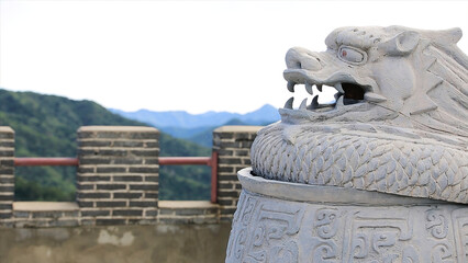 Statue of a dragon on the great wall of China. The great wall of China, which is a white statue of a dragon