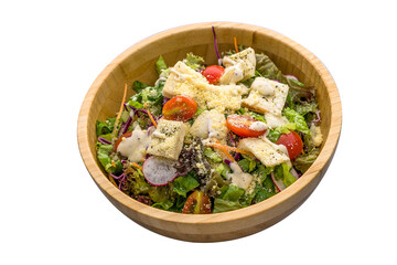 Caesar Salad served in a dish isolated on plain white background side view