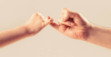 Show friendship and forgiveness. Friendship of generations. Father, daughter hand making promise...