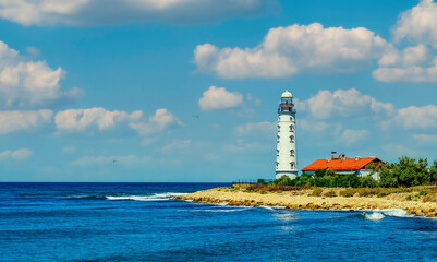 Fototapeta na wymiar Chersonese lighthouse in Sevastopol on the Black Sea coast, beautiful coastal landscape.