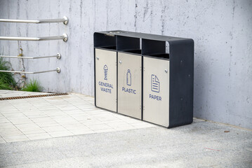 The three different container for sorting garbage. For plastic, paper, metal waste