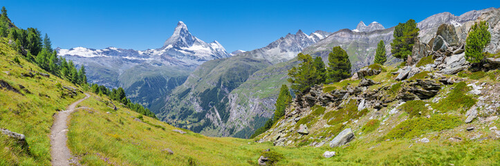 Fototapeta na wymiar The panorama of swiss walliser alps with the Matterhorn peak over the mattertal valley.