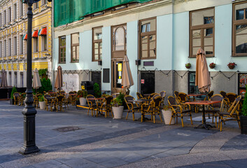 Stoleshnikov lane with tables of cafe in Moscow, Russia. Moscow architecture and landmark. Moscow...