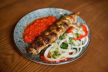kebab on a skewer with pepper and onion rings