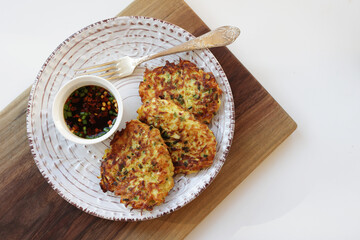 Zucchini fritters, vegetarian zucchini fritters, served with soy dipping sauce.
