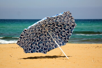 Umbrella for shelter from the sun on the city beach.