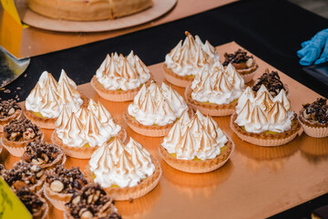 A variety of sweets and desserts are sold in a street shop