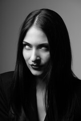 Beauty, make-up, horror and fashion concept. Sexy and beautiful woman with white eyes and long dark...