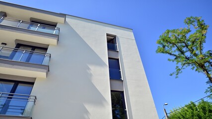 Modern luxury residential flat. Modern apartment building on a sunny day. Apartment building with a blue sky. Facade of a modern apartment building.