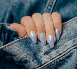 Beautiful blue nail manicure. Stylish pastel blue manicure. Nail polish. Art blue manicure. Female...