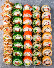 set of different colorful maki sushi rolls sushi texture background © smspsy