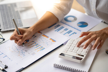 Crop shot of Bookkeeper or financial inspector hands making the report, and calculating. Home finances, investment, economy, saving money, or insurance concept