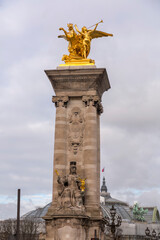 Fototapeta na wymiar The Pont Alexandre III is a deck arch bridge that spans the Seine in Paris