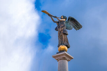 Statue of an angel blowing a trumpet by sculptor Romas Vilčiauskas at Uzupis (Užupis) - popular district among artists in Vilnius © Valera Rychman