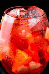 Classic italian aperol spritz cocktail in glass on dark