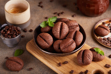 Mocha cookies in a shape of coffee beans. Delicious homemade biscuits with chocolate.