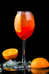 Classic italian aperol spritz cocktail in glass on dark. cocktail aperol