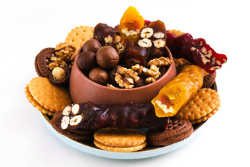 Churchkhela - Georgian national delicacy and nuts with cookies around on a white background. Close-up