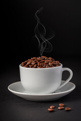 Macro photography of coffee beans, cup, saucer, steam