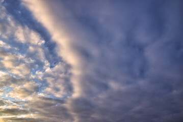 Naklejka na ściany i meble Beautiful morning sky with colorful clouds before sunrise. Dramatic sunset and sunrise 