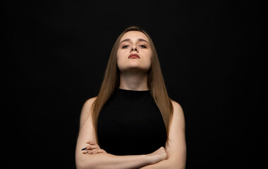 Fototapeta premium Negative human emotions and feelings. Grumpy young woman posing, frowning eyebrows, her look and grimace expressing anger, annoyance and dislike.